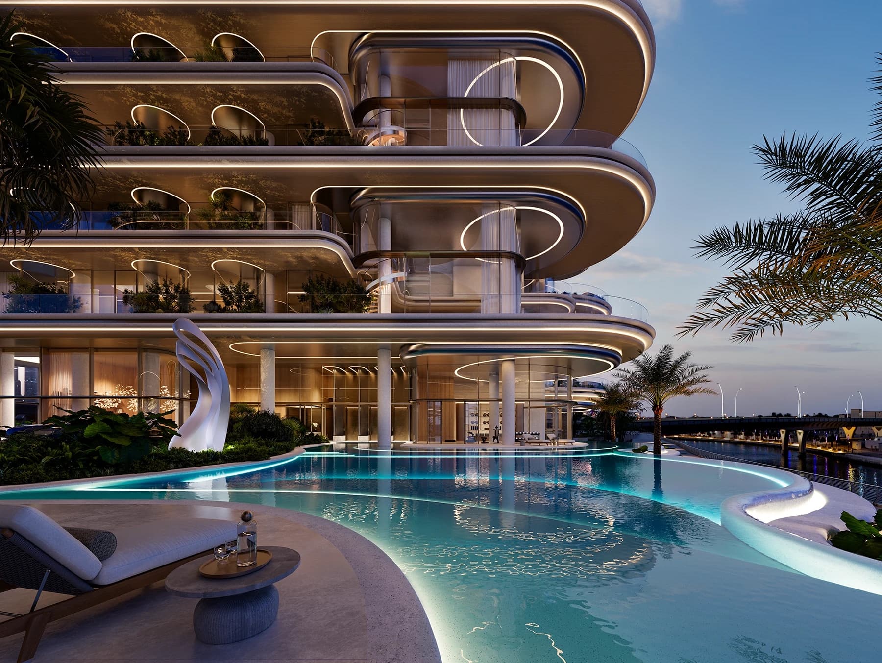 Facade detail of The Rings by PMR with the canal-front pool terrace at dusk